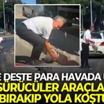 İzmir'de deste deste para havada uçuştu: Sürücüler araçları bırakıp yola koştu!