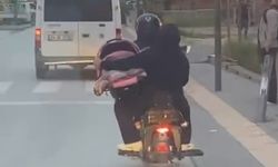 Bursa'da korku dolu anlar: Motosikletin üzerinde bebeği pusette taşıdı!