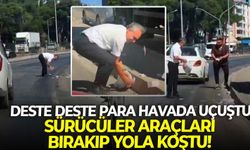 İzmir'de deste deste para havada uçuştu: Sürücüler araçları bırakıp yola koştu!