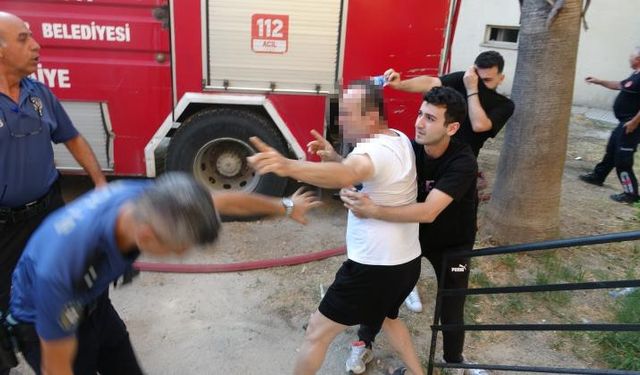 Yaşadığı daireyi ateşe verdi, linçten polis kurtardı